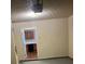 A garage space with an automatic door opener and a peek into the kitchen at 2127 Manhattan Pkwy, Decatur, GA 30035