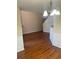 Cozy living room featuring hardwood floors, fireplace, and staircase access at 2127 Manhattan Pkwy, Decatur, GA 30035
