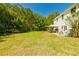 Expansive backyard featuring lush green grass and a cozy gazebo, perfect for relaxation and outdoor activities at 2365 Oakland Trail Way, Lawrenceville, GA 30044