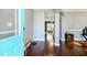 Inviting foyer featuring hardwood floors, a turquoise door, and an open view into the living spaces at 2365 Oakland Trail Way, Lawrenceville, GA 30044