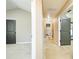 Hallway with multiple doors and neutral carpeting; bright and airy at 2365 Oakland Trail Way, Lawrenceville, GA 30044