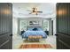 Spacious main bedroom with a tray ceiling, ceiling fan, and carpet at 2365 Oakland Trail Way, Lawrenceville, GA 30044