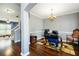 Open office space with hardwood flooring, a chandelier, and an elegant chair at 2365 Oakland Trail Way, Lawrenceville, GA 30044