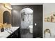 Upscale bathroom featuring dual vanities, sleek lighting, and a spacious marble shower at 2541 Peyton Woods Sw Trl, Atlanta, GA 30311
