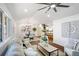 Bright open concept living room with modern decor, dining area, and bar seating at 2541 Peyton Woods Sw Trl, Atlanta, GA 30311