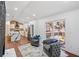 Open-concept living area with hardwood floors, modern kitchen, and sliding door to deck at 2541 Peyton Woods Sw Trl, Atlanta, GA 30311