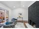 Charming living room with vaulted ceiling, black brick fireplace, and sliding glass door access at 2541 Peyton Woods Sw Trl, Atlanta, GA 30311