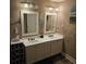 Bathroom featuring double sinks and framed mirrors at 278 Mission Oak Se Dr, Grayson, GA 30017