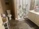 Bathroom featuring tile floors, toilet, shower with leafy curtain, and a vanity with storage at 278 Mission Oak Se Dr, Grayson, GA 30017