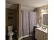 Bathroom featuring toilet, vanity, framed mirror, shower-tub combo and neutral walls at 278 Mission Oak Se Dr, Grayson, GA 30017
