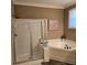 Bathroom with shower, garden tub, and natural lighting at 278 Mission Oak Se Dr, Grayson, GA 30017