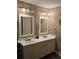 Well-lit bathroom featuring double sinks and large mirrors with decor at 278 Mission Oak Se Dr, Grayson, GA 30017