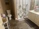 Traditional bathroom with a white vanity, toilet and shower with leaf-patterned curtain at 278 Mission Oak Se Dr, Grayson, GA 30017