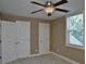 Bedroom featuring a ceiling fan, neutral colored walls, and a window with blinds at 278 Mission Oak Se Dr, Grayson, GA 30017