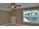 Bedroom featuring a ceiling fan and a window offering natural light and privacy blinds at 278 Mission Oak Se Dr, Grayson, GA 30017