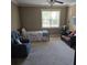 Bedroom with neutral walls, ceiling fan, plush carpeting, single bed, and casual seating at 278 Mission Oak Se Dr, Grayson, GA 30017