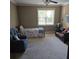 Neutral bedroom featuring seating and a bed with natural light from the window at 278 Mission Oak Se Dr, Grayson, GA 30017