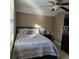 Bedroom featuring a bed with floral patterned bedding, and a TV at 278 Mission Oak Se Dr, Grayson, GA 30017