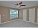Bedroom featuring a large window providing natural light and plush carpeting at 278 Mission Oak Se Dr, Grayson, GA 30017