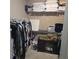 Organized walk-in closet with shelving, hanging space, and a small cabinet for storage at 278 Mission Oak Se Dr, Grayson, GA 30017