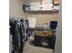 Walk-in closet featuring shelving, hanging clothes, and a built-in cabinet at 278 Mission Oak Se Dr, Grayson, GA 30017