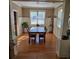 Bright dining room featuring wood floors, wainscoting, and a view of the backyard at 278 Mission Oak Se Dr, Grayson, GA 30017