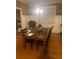 Elegant dining room with hardwood floors, wainscoting, and a stylish chandelier at 278 Mission Oak Se Dr, Grayson, GA 30017