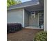 Exterior side of home with patio and trimmed bushes at 278 Mission Oak Se Dr, Grayson, GA 30017