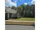 Charming home with a well-kept lawn, mature trees, and inviting appeal at 278 Mission Oak Se Dr, Grayson, GA 30017