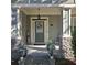 Inviting front porch with decorative columns and floral accents at 278 Mission Oak Se Dr, Grayson, GA 30017