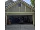 Garage with a parked car and plenty of storage space at 278 Mission Oak Se Dr, Grayson, GA 30017