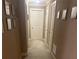 Neutral colored hallway with decorations on the walls at 278 Mission Oak Se Dr, Grayson, GA 30017