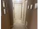 Hallway decorated with multiple framed pictures on each wall leading to several doors at 278 Mission Oak Se Dr, Grayson, GA 30017