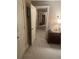 Hallway with view into bedroom with nightstand and lamp at 278 Mission Oak Se Dr, Grayson, GA 30017