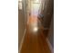 Inviting hallway featuring beautiful hardwood floors and elegant decor at 278 Mission Oak Se Dr, Grayson, GA 30017