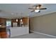 Open-concept kitchen with modern appliances, dark wood cabinets, and ample counter space at 278 Mission Oak Se Dr, Grayson, GA 30017