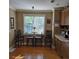 Bright breakfast nook features hardwood floors and a sunlit window at 278 Mission Oak Se Dr, Grayson, GA 30017