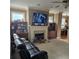 Open concept living room features neutral carpeting, a fireplace, and a ceiling fan at 278 Mission Oak Se Dr, Grayson, GA 30017