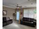 Spacious living room with comfortable seating, natural light, and access to the outdoors at 278 Mission Oak Se Dr, Grayson, GA 30017