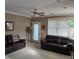 Bright living room with large windows, plush seating, and access to the backyard at 278 Mission Oak Se Dr, Grayson, GA 30017