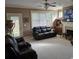 Cozy living room with a plush leather sofa, fireplace, and abundant natural light at 278 Mission Oak Se Dr, Grayson, GA 30017