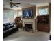 Cozy living room with a fireplace, built-in shelves, and a comfortable leather sofa at 278 Mission Oak Se Dr, Grayson, GA 30017