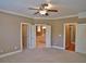 Spacious main bedroom with a ceiling fan and ensuite bathroom access at 278 Mission Oak Se Dr, Grayson, GA 30017