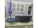 Outdoor patio features dining set, umbrella, and convenient access to the home's interior at 278 Mission Oak Se Dr, Grayson, GA 30017