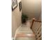 Carpeted staircase with wood railing, leading to the upper level of the home at 278 Mission Oak Se Dr, Grayson, GA 30017