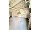 Unfinished basement with work tables, storage shelves, and concrete flooring at 1445 Diplomat Dr, Riverdale, GA 30296