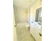 Bathroom featuring shower-tub combo, tile surround, and modern vanity at 1445 Diplomat Dr, Riverdale, GA 30296