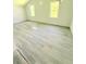 A spacious bedroom is brightened by natural light coming in through two windows at 1445 Diplomat Dr, Riverdale, GA 30296