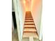 A staircase leads to an upper level, brightened by the lights above at 1445 Diplomat Dr, Riverdale, GA 30296