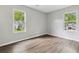 Spacious bedroom filled with natural light from two large windows at 1647 Imperial Ct, Norcross, GA 30093